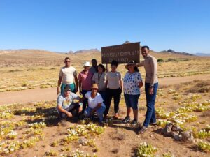 People standing in front of sign at Richtersveld